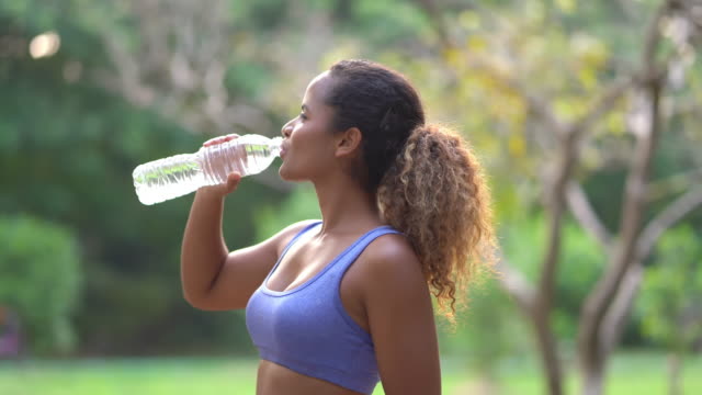 Sporty woman drink